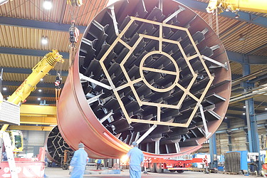 Photo of a copper-colored large container with filigree details in the Dinklage production facility
