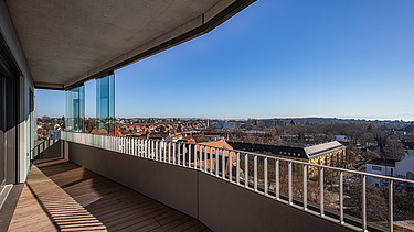 Balcony view from the building with modern grounds in the sunshine
