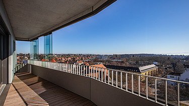 Balcony view from the building with modern grounds in the sunshine