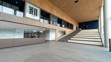 Entrance area of the new administration center - Stadtforum Dresden with wooden ceiling and large staircase