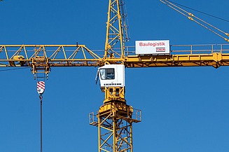 Picture of a yellow crane with ZÜBLIN branding