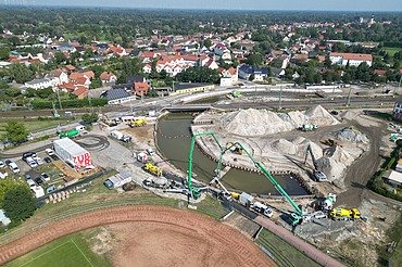 Aerial view of a construction site with railroad line