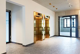 Stairwell with elevators at INK Inspire Neukölln in Berlin
