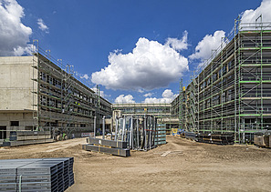 Building site and façade work with scaffolding in the school centre