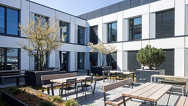 Outdoor area with seating at ASTO Campus Zwei in Gilching