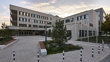 Exterior view of the grammar school with a view of the schoolyard