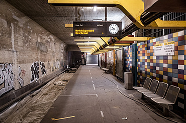 Photo of a subway stop with graffiti 