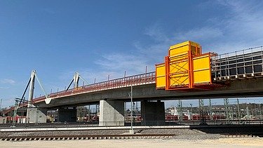 Photo of a bridge with yellow box 