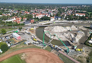 Aerial view of a construction site with railroad line
