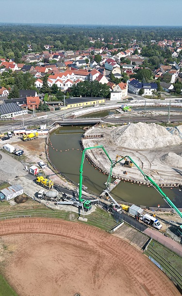 Aerial view of a construction site with railroad line