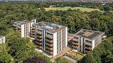 Aerial view of the PURA residential complex with a view of the countryside