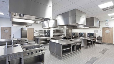 Modern kitchen area in the school canteen with professional equipment