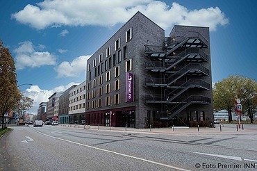 Daytime view of the PREMIER INN Hamburg-St. Pauli hotel building with modern architecture