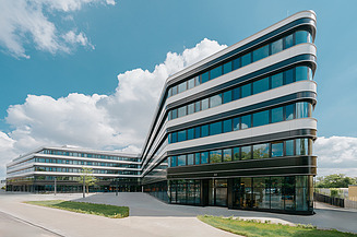 Picture of an office building with a large glass front