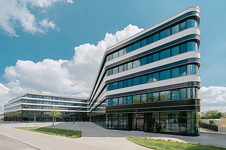 Picture of an office building with a large glass front