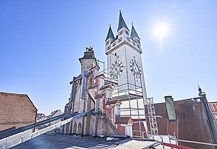 Historical building view of Straubing town hall with neo-Gothic façade and striking tower.