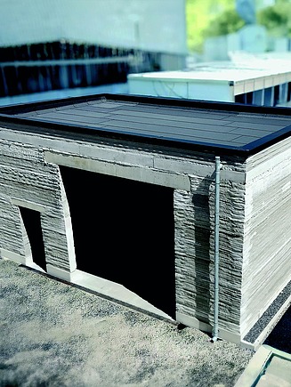 Fertiges kleines Gebäude das aus 3D-Betondruck errichtet wurde