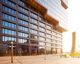 Exterior view of the lower part of an office building in beautiful sunlight. 