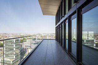 Picture from the balcony of an office building with a view of the city.