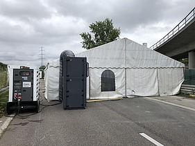 Photo of a tent with generator
