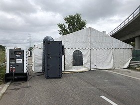 Photo of a tent with generator