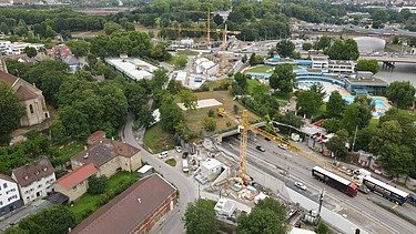 Photo of a construction site at a tunnel entrance from the air
