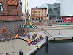 Construction site at Hansakai with crane work and precast concrete elements