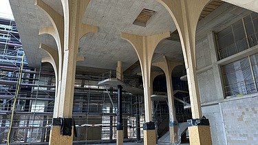 Construction site image of the atrium, which was built with wooden pillars