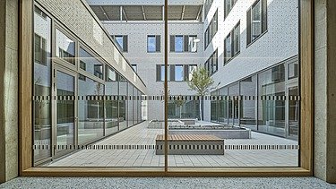 Window view of the inner courtyard of the SKD