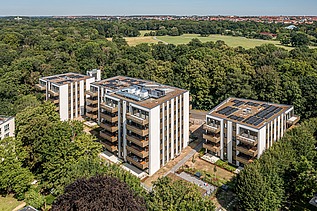 Aerial view of the PURA residential complex with a view of the countryside