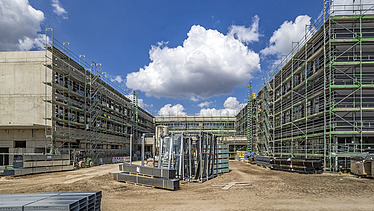 Building site and façade work with scaffolding in the school centre