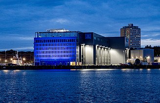 Front view of the shipbuilding hall in Kiel at night 