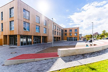Exterior photo of Wiiten/Herdecke University with wooden façade