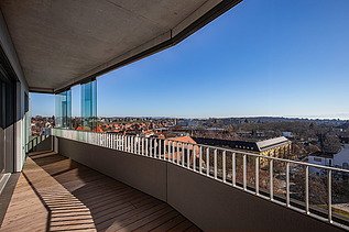 Balcony view from the building with modern grounds in the sunshine