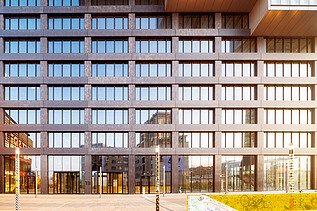 Close-up of an office building in warm sunlight.