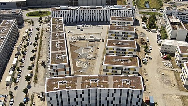 View of a block of houses in the Sonnenhöfe urban quarter in Berlin Neu-Schönefeld