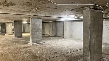 Photo of columns on an underground parking garage deck