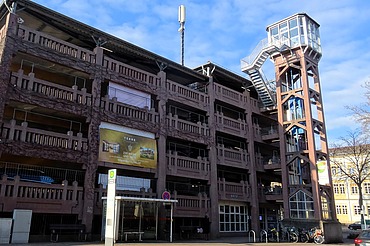 Photo of a parking garage with elevator tower