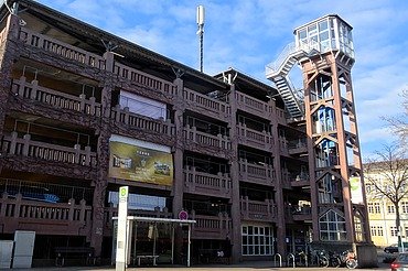 Photo of a parking garage with elevator tower
