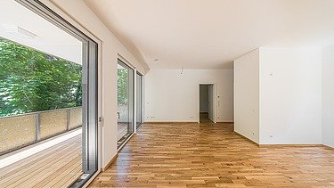 Example of a room with light parquet flooring in the PURA residential complex