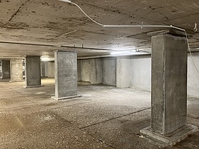 Photo of columns on an underground parking garage deck