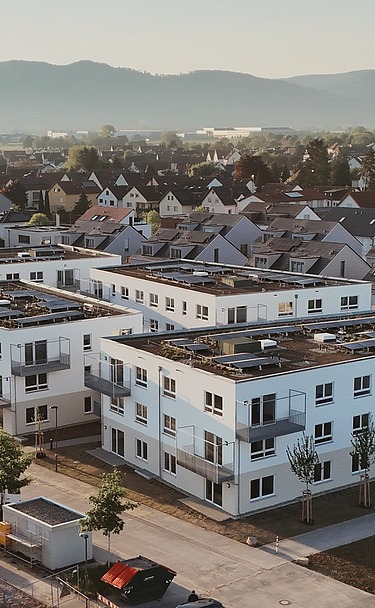 Aerial view of the white buildings of Wohnquartett Heddesheim