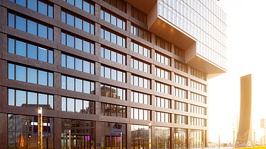Exterior view of the lower part of an office building in beautiful sunlight. 