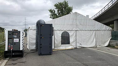 Photo of a tent with generator