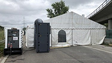 Photo of a tent with generator