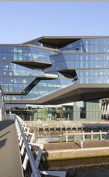 Exterior view of the ODE building from a bridge