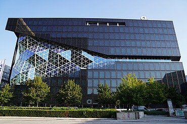 Exterior view of the new Axel Springer building in Berlin with large 3D façade