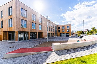 Exterior view of Witten-Herdecke University with wooden façade