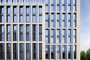 Exterior shot of an office building, focus on the façade.