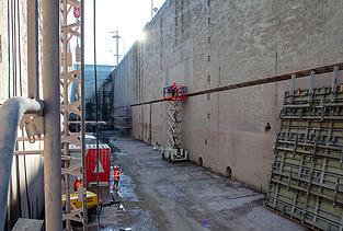 Photo of a wall of a sluice with pipes